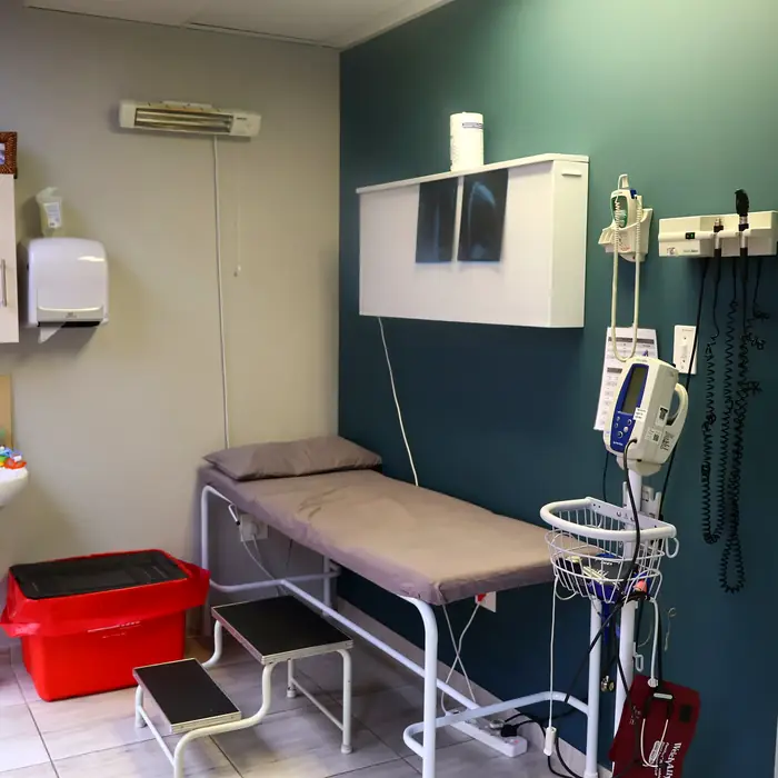 Examination room with examination bed and diagnostic equipment